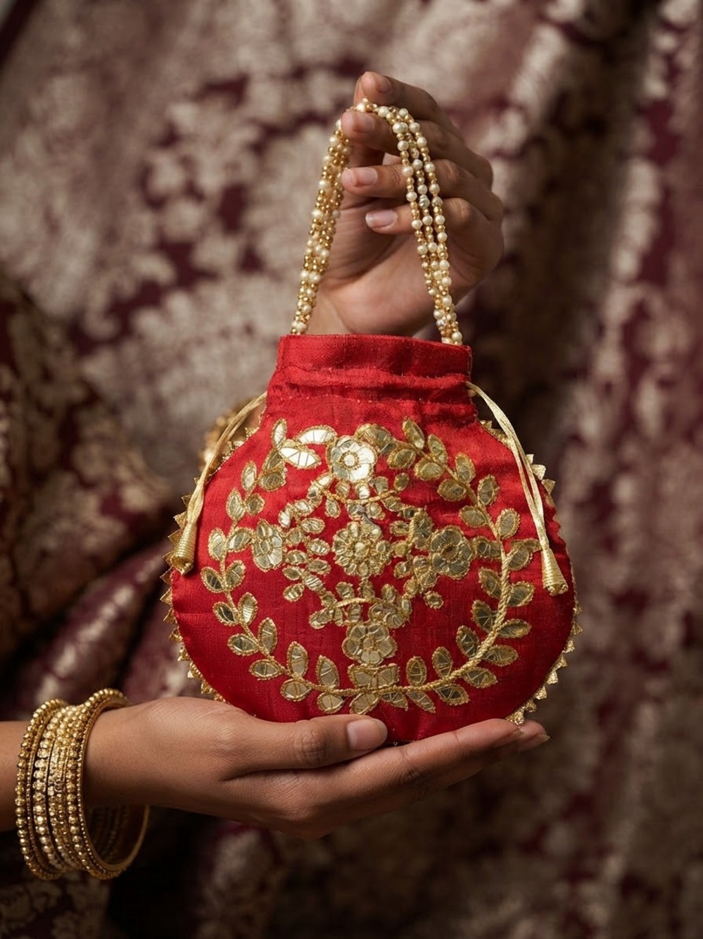 Embroidered Red Potli Bag with Gold Beaded Handle